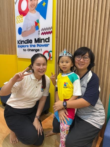 Happy child with teacher and parent